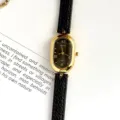 Montre quartz ovale pour femme avec bracelet en cuir noir élégant et cadran minimaliste - Boîtier Or Cadran Noir Bracelet Noir