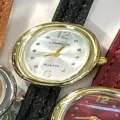 Women vintage oval quartz watch with black leather strap and gold tone metal case for daily wear. - Gold Case White Dial Black Strap