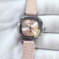 Detailed view of the kloris women's quartz watch featuring a pink leather strap and silver square dial. - Silver Case Pink Dial Pink Strap