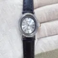 Kloris women quartz watch detail, elegant oval rhinestone dial with black leather strap. - Silver Case White Dial Black Strap