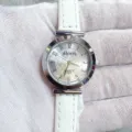 Kloris women quartz watch with white leather strap and silver dial detailed closeup view. - Silver Case White Dial White Strap