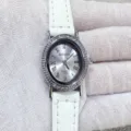 Kloris women quartz watch detail view, elegant oval rhinestone bezel with white leather strap. - Silver Case White Dial White Strap