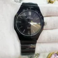 Detailed view of the black quartz men's watch with steel strap and dual calendar display. - Gun Black Black Face
