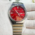 Men's quartz watch with striking red dial, stainless steel integrated strap and day date display. - Silver Case Red Dial