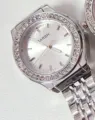 Stylish silver quartz watch featuring dazzling rhinestones and an elegant metal strap for women. - Silver Case White Dial