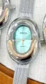 KOUSHI women's quartz watch featuring an elegant oval bezel and stylish mesh strap. - Silver Case Light Blue Dial