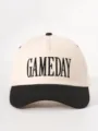 Detail shot of color-block baseball cap with embroidered front text and curved brim. - Adjustable / Beige and Black
