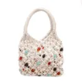 Handcrafted beaded macrame handbag close-up showing intricate woven texture and colorful beads detail - Off White