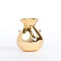 Gold acrylic metallic money bag detail shot, shiny glossy evening purse surface design. - Gold