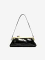 Black patent leather baguette shoulder bag with chic gold frame clasp and vintage crocodile texture. - Black