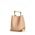 Detail view of the elegant leather bucket bag featuring a unique gold handle and sphere accent. - Apricot