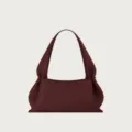Minimalist leather shoulder bag, elegant underarm handbag with chic gathered dumpling shape. - Burgundy