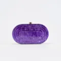 Close-up detail of purple marble acrylic evening clutch, glossy hard shell surface finish. - Deep purple