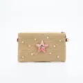 Detailed view of the stylish straw woven shoulder bag featuring a beaded starfish and pearl decor. - Envelope Star
