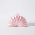 Pink shell acrylic clutch bag detail showing the exquisite pearl clasp and shape. - Pink