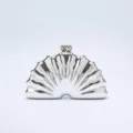 Silver shell clutch bag detail, metallic evening party purse, exquisite clasp closure close up. - Silver