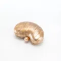Detailed view of the elegant bean-shaped acrylic evening clutch in glossy brown marble. - Champagne