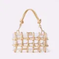 Clear acrylic box bag detail, gold rope knot weave accent, luxury hardware lock clasp. - Gold
