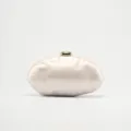 Acrylic evening clutch bag detail showing glossy pearl finish and gold clasp for women wedding. - Ivory