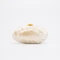 Acrylic clutch bag detail view, marble pattern surface, elegant gold metal clasp hardware. - Off White