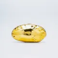 Gold acrylic evening clutch detail, glossy irregular pebble shape, metallic clasp. - Gold