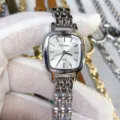 Detail shot of a square silver quartz watch with metal strap, showing dial and texture clearly. - Silver Case White Dial