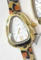 Women leopard mesh strap quartz watch with unique teardrop case and Roman numerals stylish. - Serpentine Irregular Case Style (Style 1)