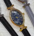 SUNLIFEX elegant oval quartz watch with black leather strap for women chic daily wear. - Gold Case Blue Dial Black Strap