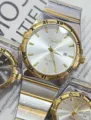 Gold silver two tone quartz watch with roman numerals and date display for couples. - Two-Tone Gold White Dial Men