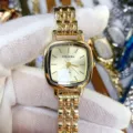 DOUKOU square women watch detail view, elegant gold metal strap and minimalist dial design. - Gold Gold Dial