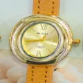 Elegant women's oval quartz watch with gold-tone case and brown leather strap for daily wear. - Gold Dial Light Brown Strap