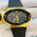 Fashionable quartz watch featuring a black silicone strap and a gold faceted bezel. - Black Dial Black Strap (Women)