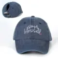 Distressed washed denim ponytail baseball cap with white and pink embroidered blessed text. - Adjustable / Navy Blue
