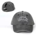 Close up view of washed grey ponytail baseball cap featuring embroidered simply blessed text. - Adjustable / Black