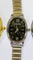 Reloj de cuarzo ovalado para mujer con elegante correa metálica extensible y esfera oscura. - Caja Plateada Esfera Negra
