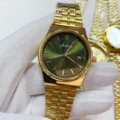Gold quartz wristwatch featuring a stylish green gradient dial and metallic bracelet variant. - All Gold Green Dial Men