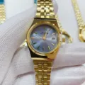 JUSTRONG golden stainless steel quartz watch for women with blue dial and date display. - All Gold Light Blue Dial Women
