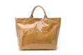 Detailed view of large capacity waterproof brown tote bag with transparent glossy finish. - Khaki