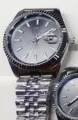OMYA Reloj de Cuarzo Impermeable Pareja Reloj Correa de Acero Calendario Hombre Mujer - Caja Plateada Esfera Negra Hombre