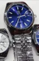 Reloj de pareja de cuarzo OMYA pulsera de metal impermeable con calendario clásico diseño - Caja Plateada Esfera Azul Hombres