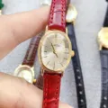 Elegant oval quartz watch for women with red leather strap and clear dial markers for daily use. - Gold Case White Dial Red Strap