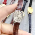 Elegant oval quartz watch with brown leather strap, minimalist dial design for women daily wear. - Silver Case White Dial Brown Leather Strap