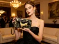 Elegant black and gold embossed deer design long clutch wallet, luxury evening bag detail. - Gold