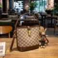 Light luxury monogram bucket bag for women, stylish leather shoulder and crossbody bag with charm. - Medium (24x11x20.5cm) / Brown