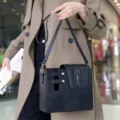 Detail view of black leather water cup bag with crocodile pattern and portable crossbody strap. - 24CM*10CM*21CM / Black