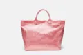 Close-up detail of the pink transparent waterproof tote bag, showcasing large capacity and texture. - Pink
