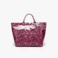 Pink leopard print tote bag detail showing glossy waterproof texture and front logo. - Purple Leopard