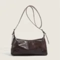 Vintage brown leather underarm bag detail, stylish retro shoulder bag for modern women. - Coffee