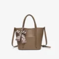 Elegant brown leather bucket handbag with stylish plaid bow, versatile shoulder crossbody bag. - Coffee