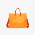 Orange washable kraft paper tote bag with crossbody strap, large capacity minimalist design. - Orange